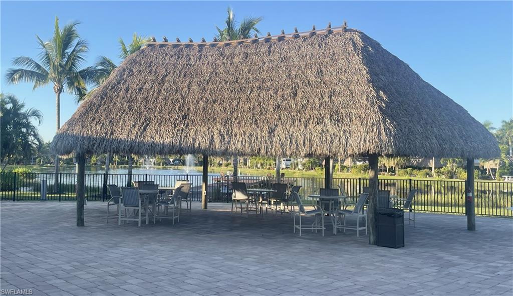 Surrounding community featuring a patio area and outdoor dining area