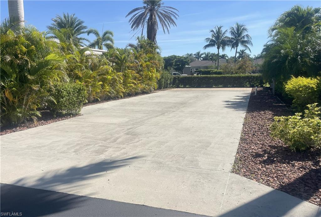 View of community featuring driveway