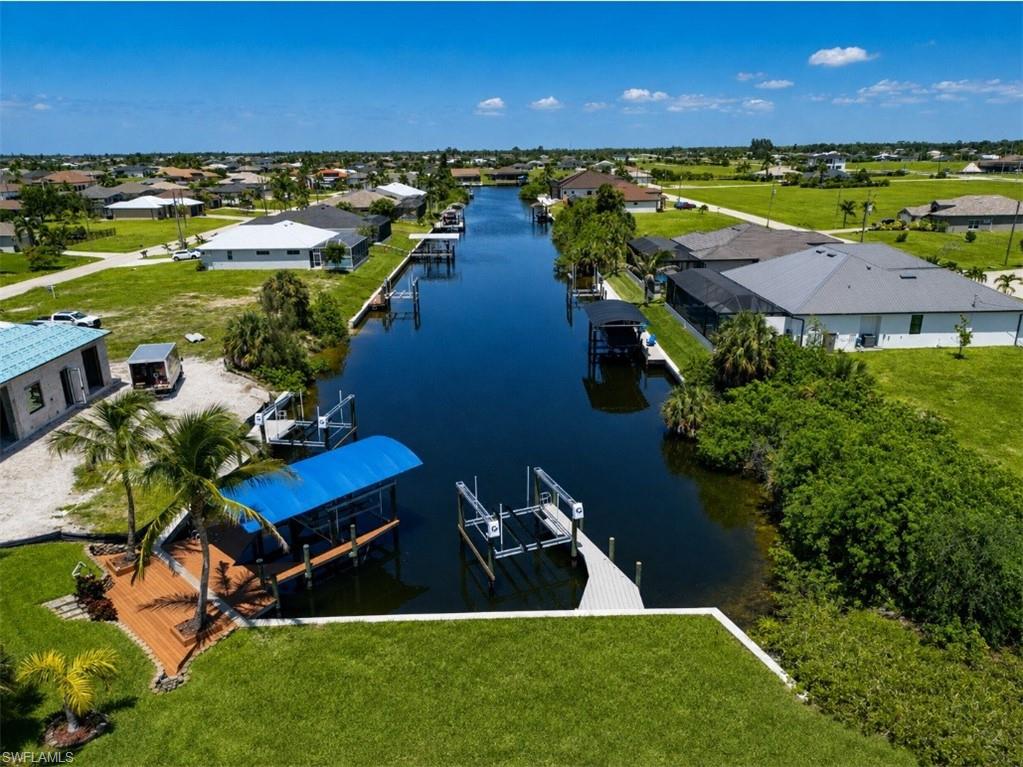 Elevated canal view highlighting the property’s waterfront setting and boating access.