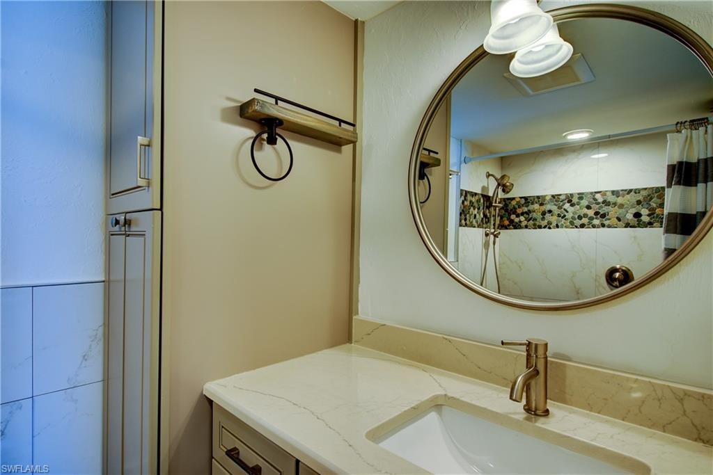Notice the custom tile inlay in the shower