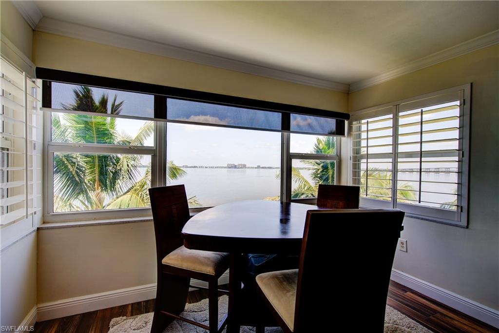 The HUGE 11' x 4' impact resistant windows allow the riverfront view to become part of your home