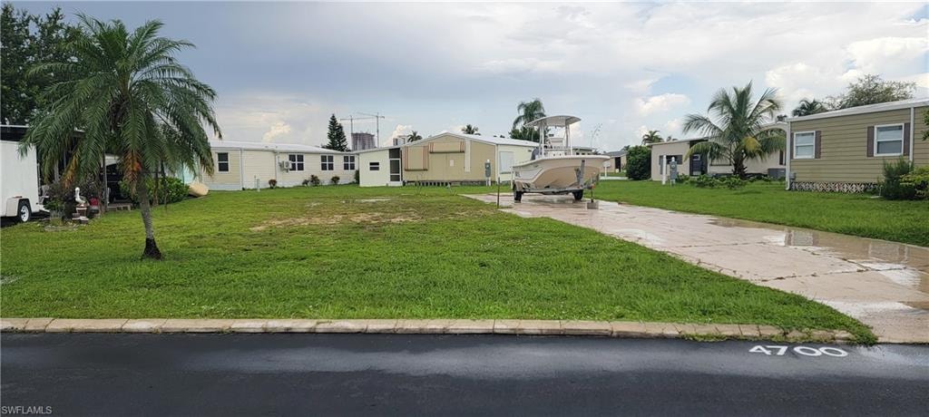 View of property with a front yard