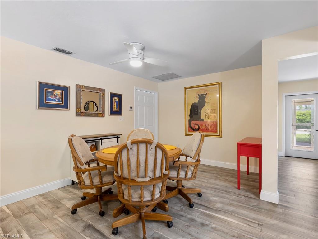 Family room with additional dining/flex area and laundry room through doorway