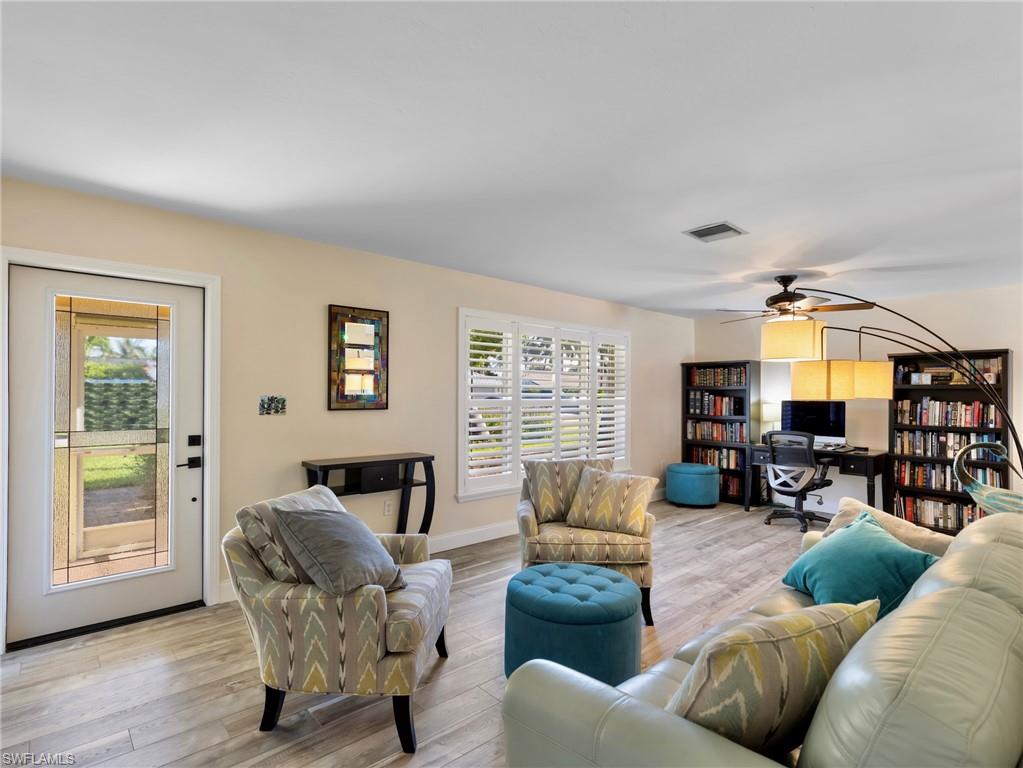 Updated engineered hardwood flooring throughout the home, and plantation shutters in the living room