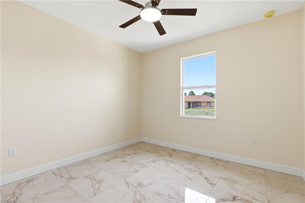 Recessed window, ceiling fan with integrated lighting, and tile flooring