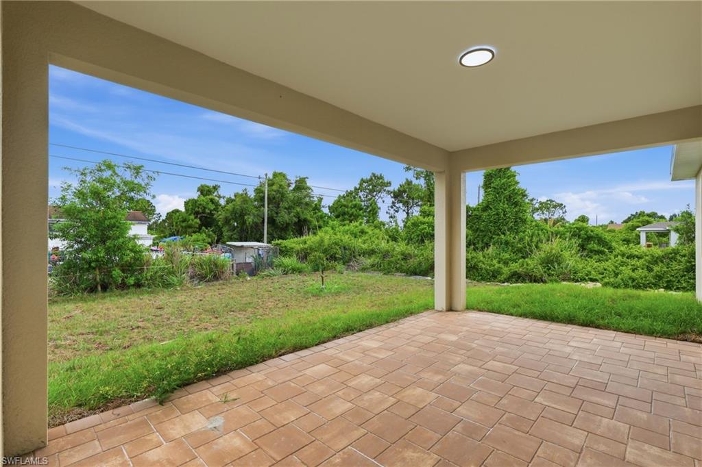 Covered patio with paver flooring and recessed lighting