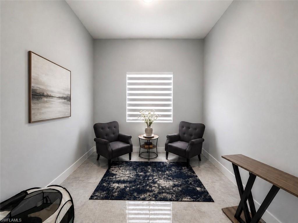 Recessed lighting, window with blinds, and tile flooring