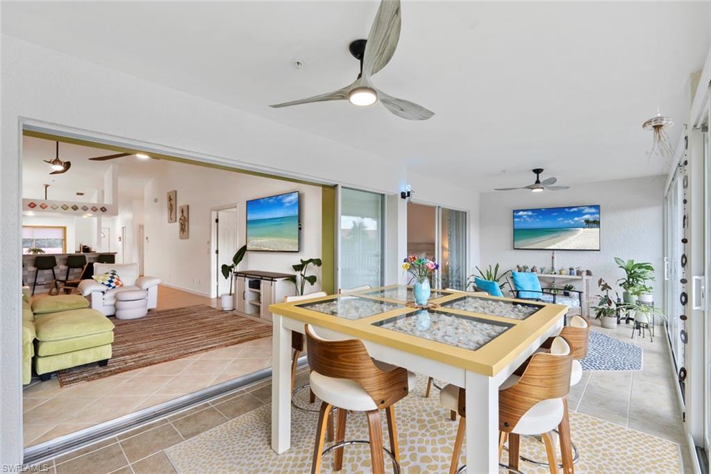 HUGE lanai with pocket sliders leading out and impact sliders enclosing the space