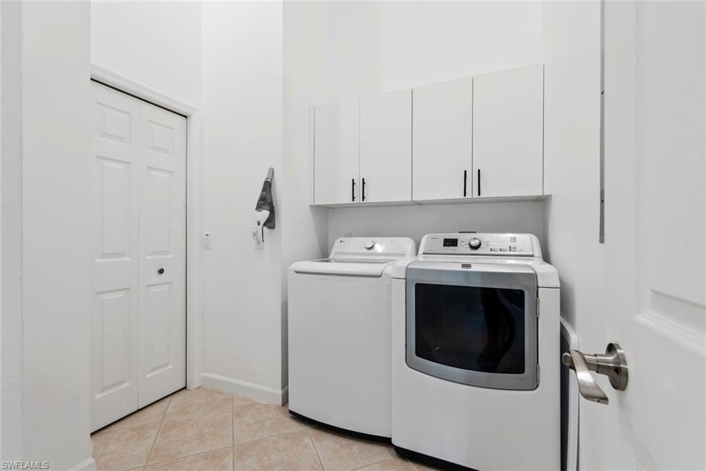 New washer, cabinets over laundry, HWH and AC in closet within