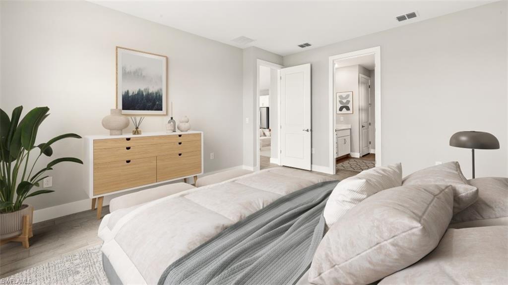 Recessed lighting, wood-finish flooring, and white interior doors