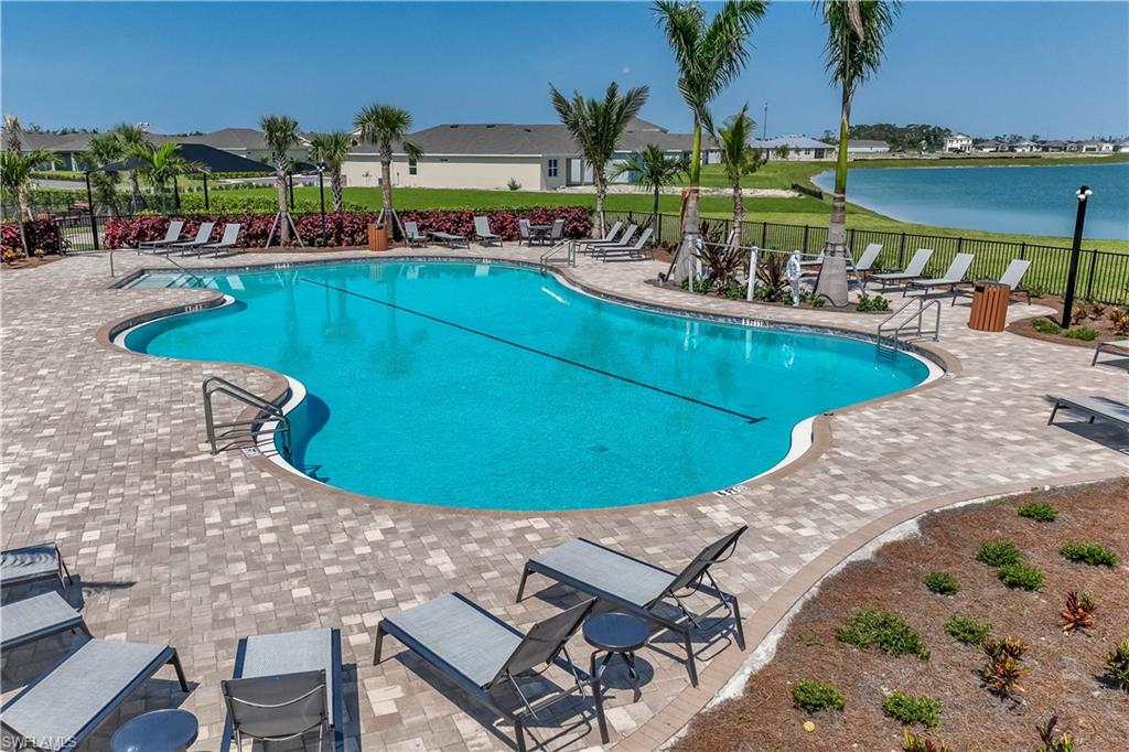 Resort-style pool with integrated spa and paver decking