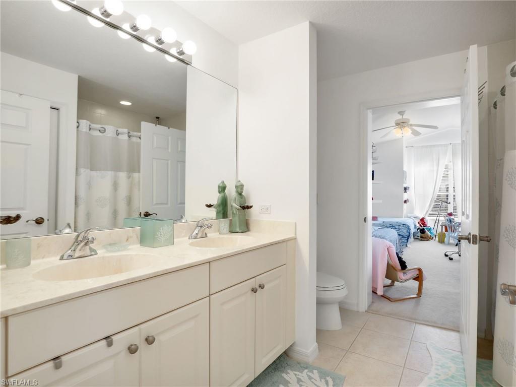 Double vanity with integrated sinks and chrome fixtures