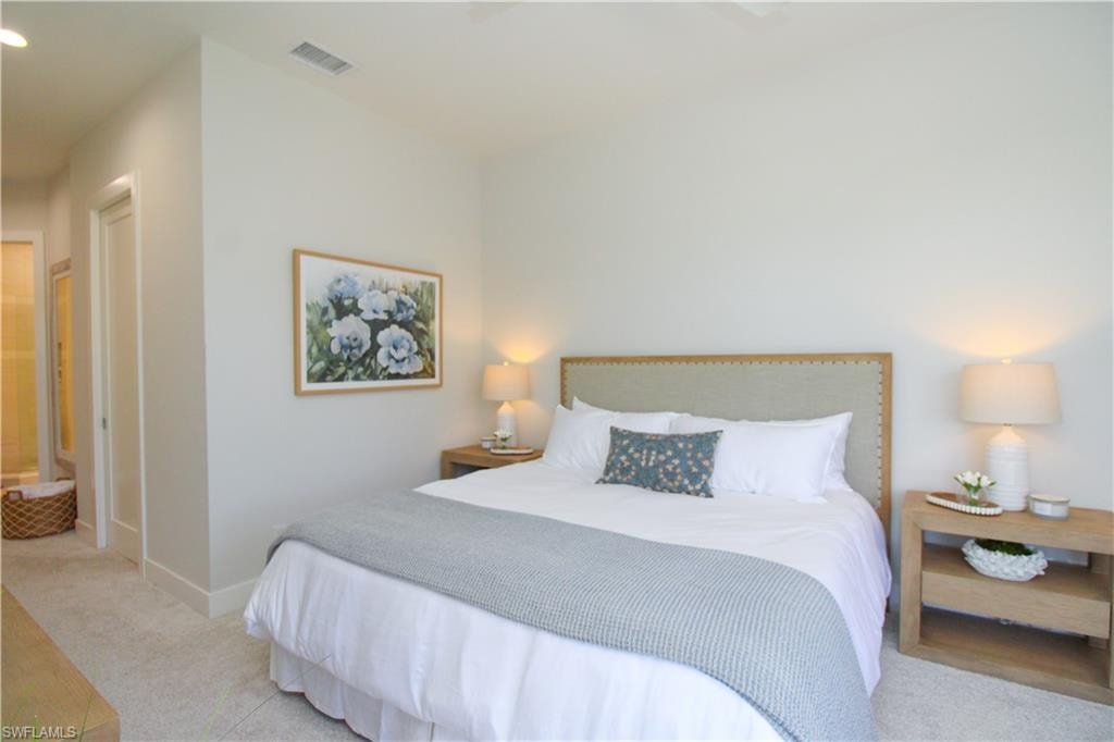 Bedroom featuring recessed lighting, light carpet, visible vents, and baseboards