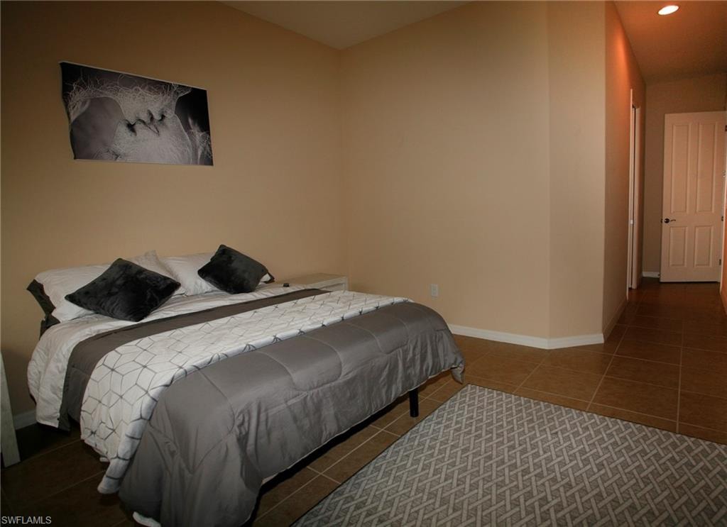 Neutral-toned walls complement the tile flooring