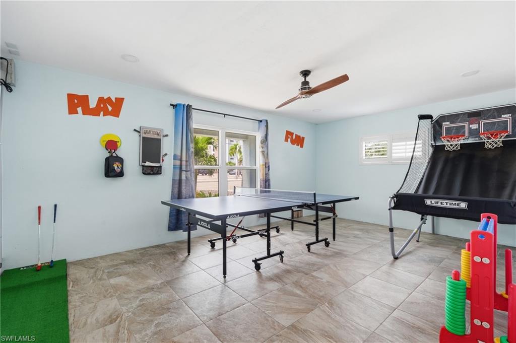 Room featuring durable tile flooring, recessed lighting, and a ceiling fan - Virtually Edited Image