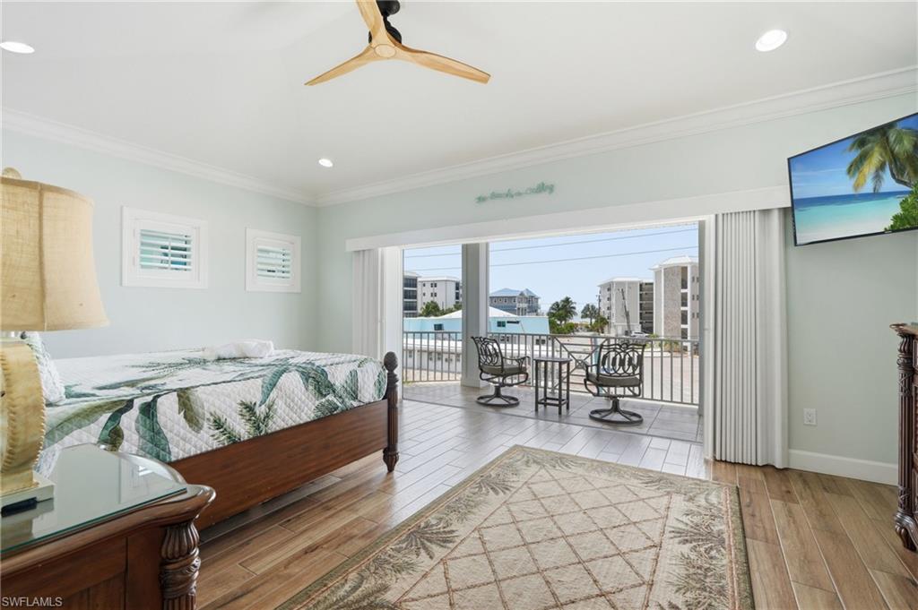 Hardwood-finish flooring, recessed lighting, and a modern ceiling fan - Virtually Edited Image