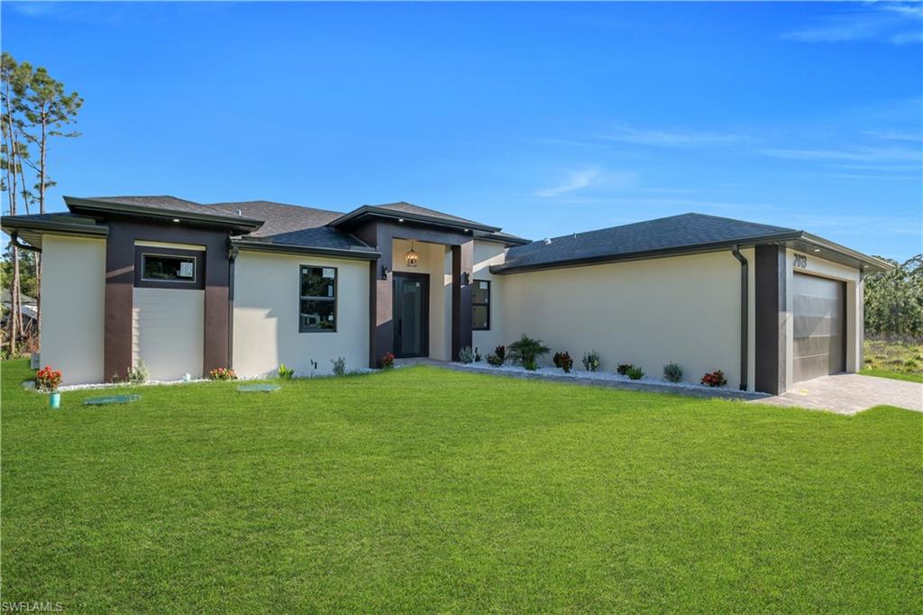 Contemporary exterior with a dark-tiled roof, light-colored stucco, and dark trim accents
