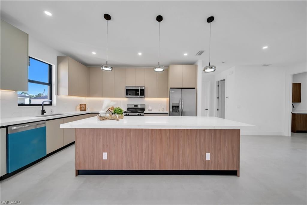 Expansive kitchen island with wood-finish paneling and a white countertop