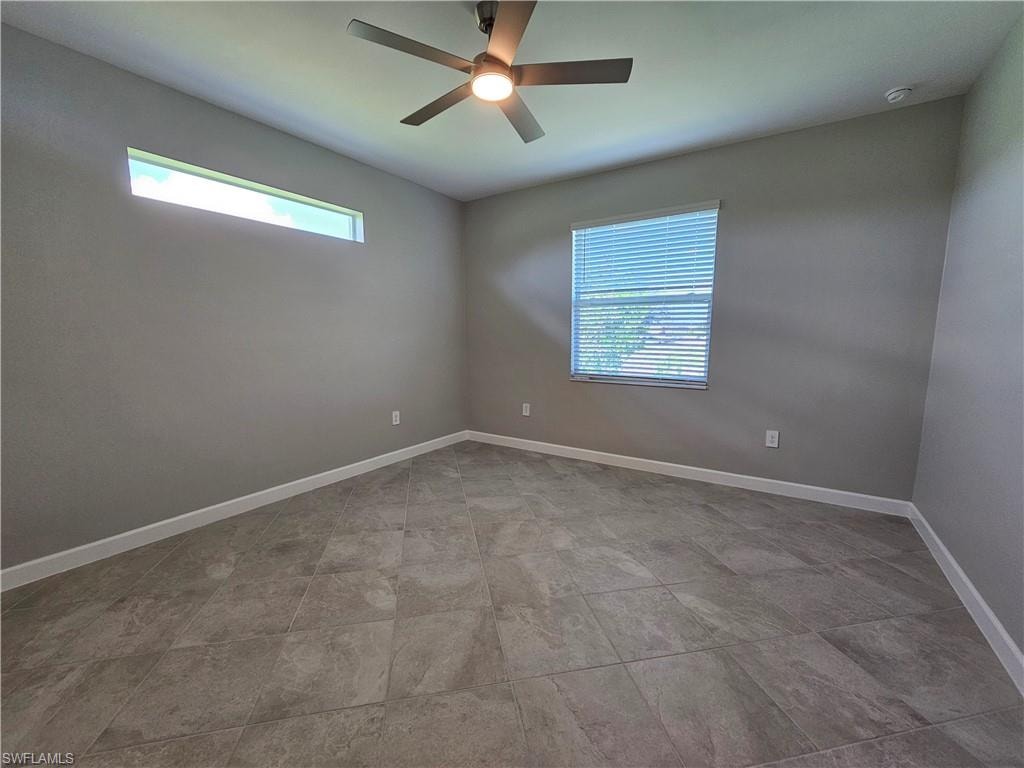 Ceiling fan with integrated lighting, a rectangular window, and a high horizontal window
