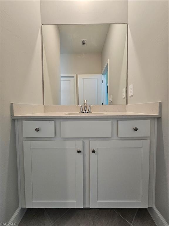White vanity with an integrated sink, polished chrome faucet, and a wall-mounted mirror