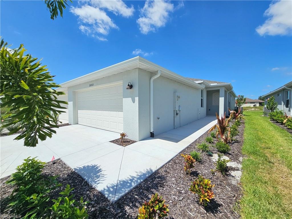 Smooth stucco exterior with white trim