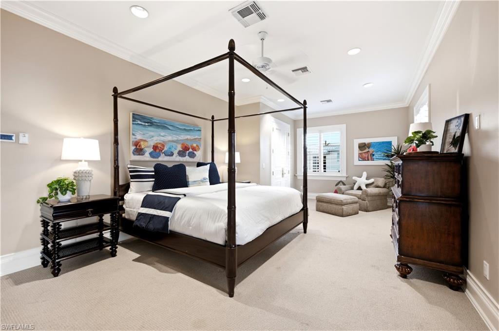 Recessed lighting, crown molding, ceiling fan, carpet flooring, and window with plantation shutters