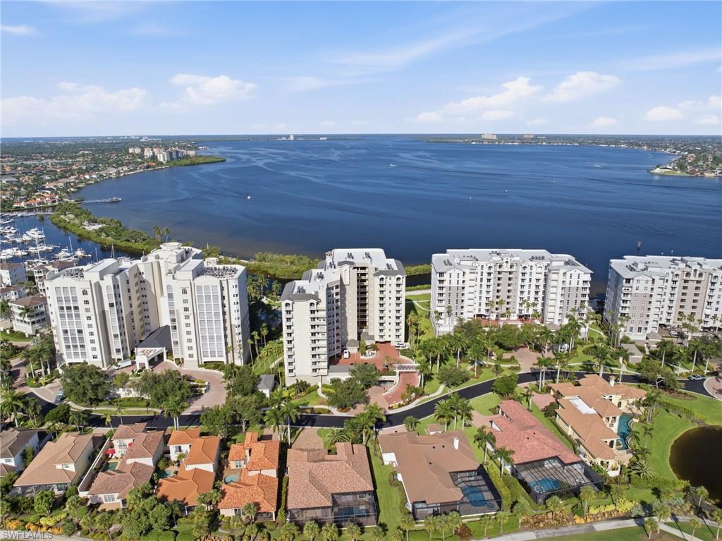 Waterfront condominium buildings with marina access and surrounding residential properties