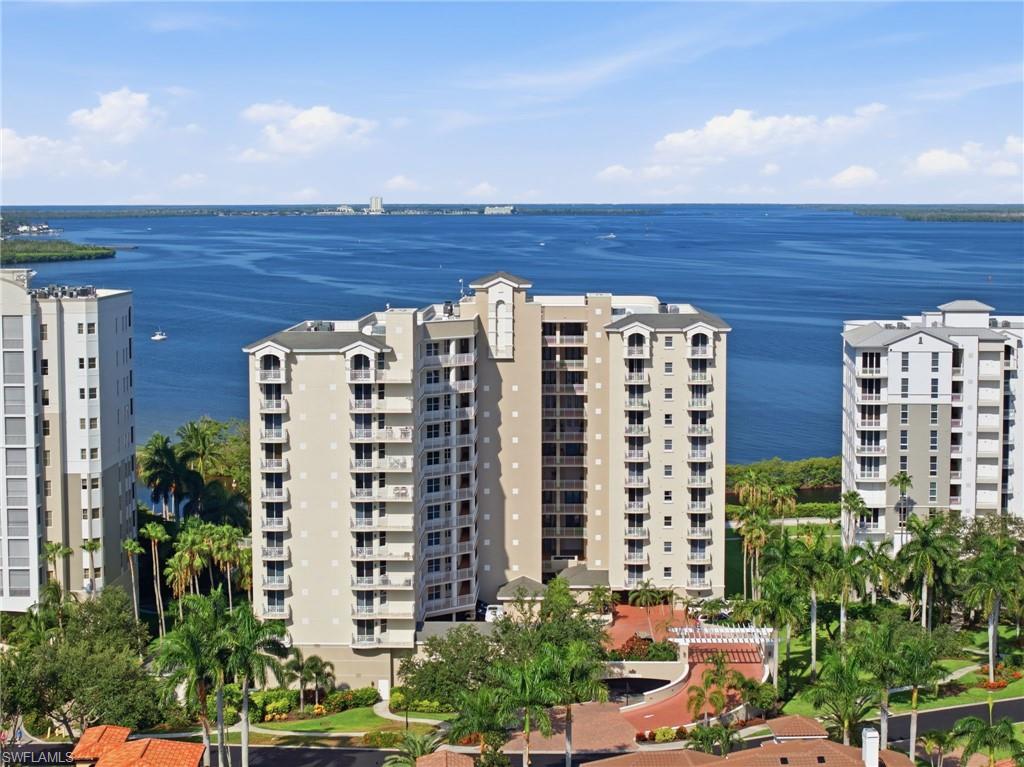 Waterfront high-rise building featuring multiple private balconies