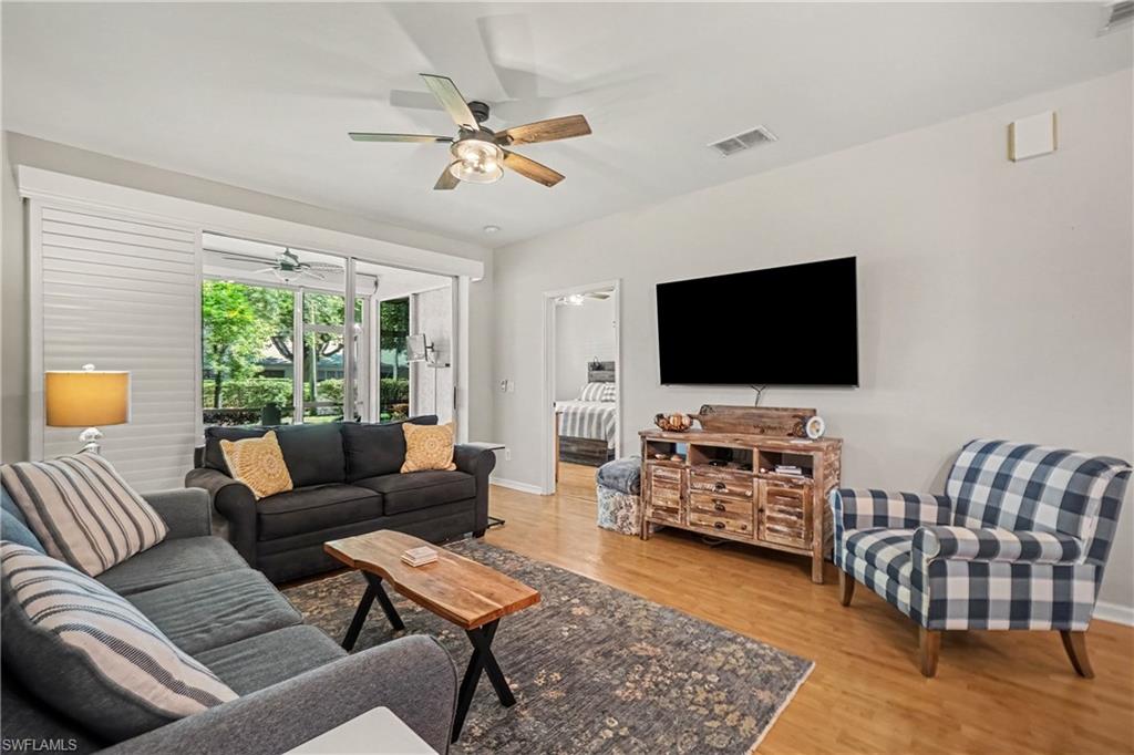 Living room with primary bedroom entrance