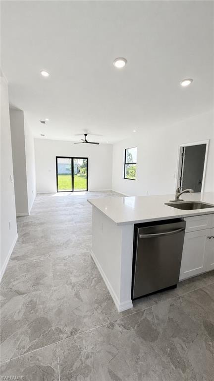 Open-concept living area with recessed lighting, large format tile flooring, and sliding glass doors
