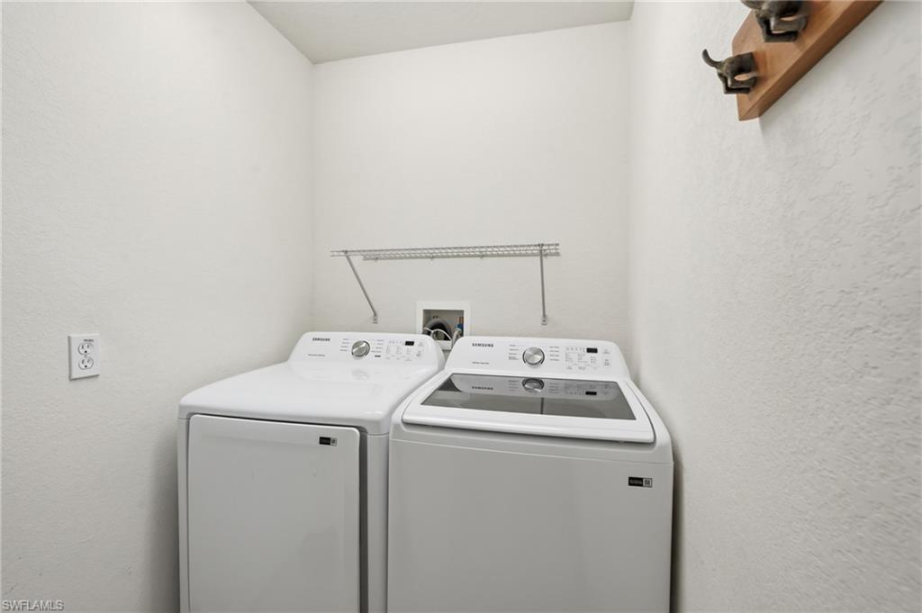 Dedicated laundry area with a wire storage shelf