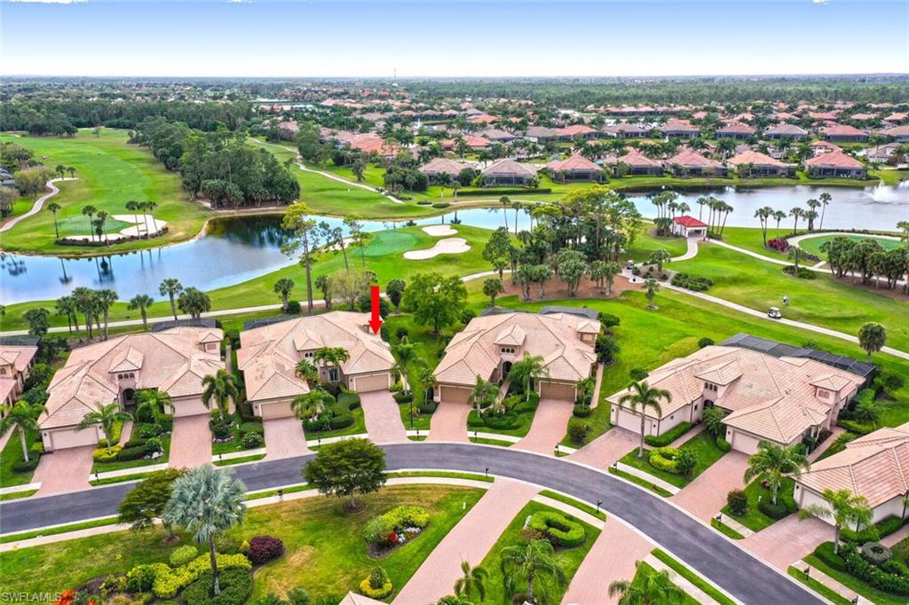Aerial view of Villa with unobstructed view of golf course and lake