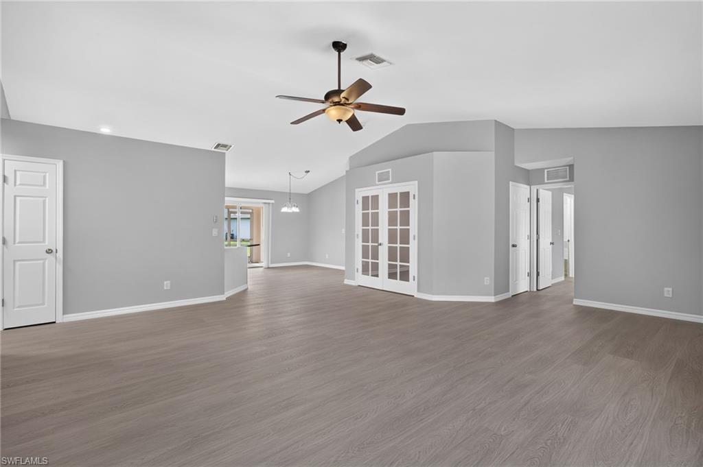 Living room with master bedroom to left, kitchen and dining in middle, and minor bedrooms on the right.