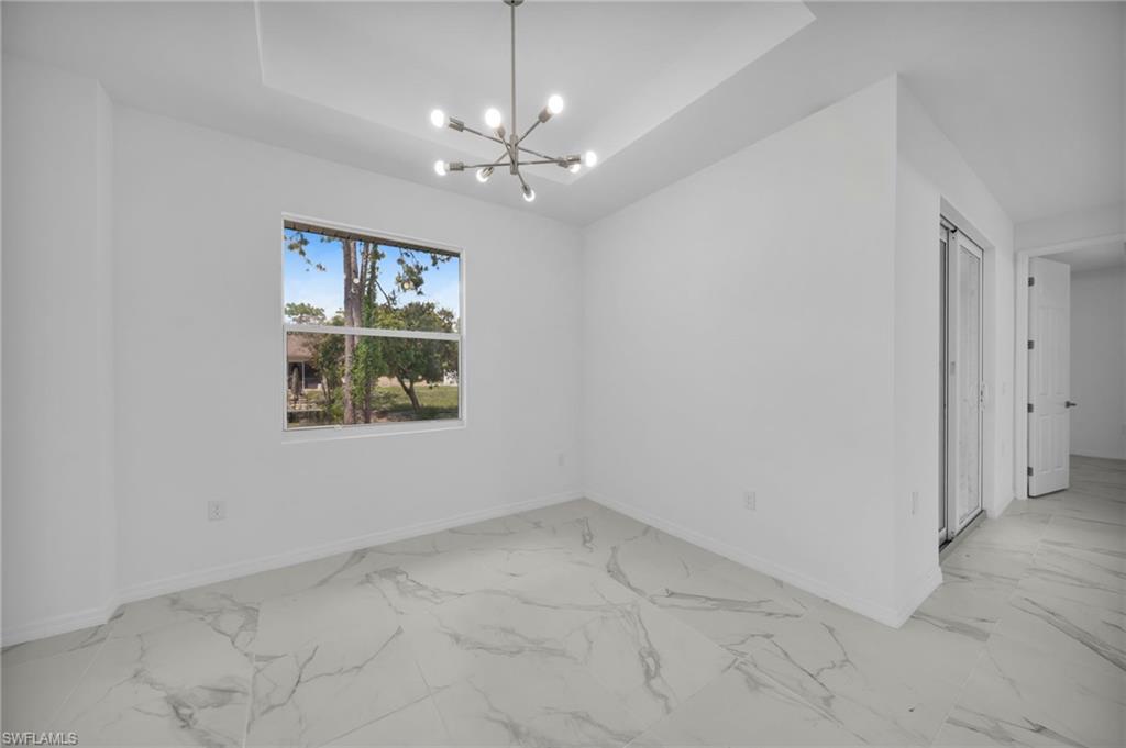 Bright interior space featuring large format marble-look tile flooring