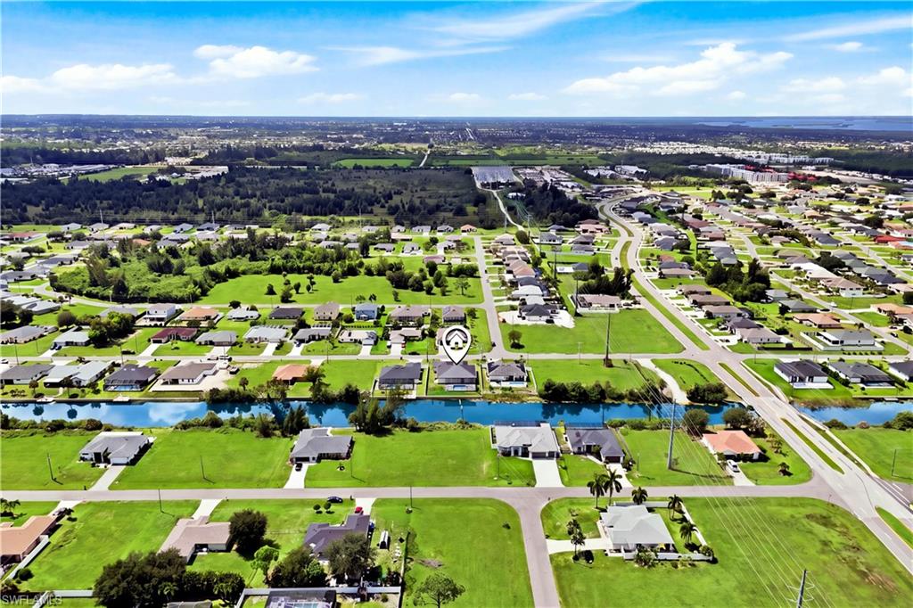 Experience modern elegance, serene canal views, upscale finishes, stunning screened spa & pool with EXCEPTIONAL SWFL living!
