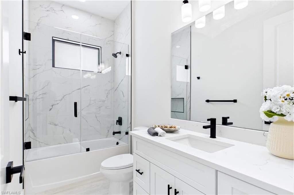 STYLISH HALL BATHROOM makes everyday routines effortless w/ a bright modern design, QUARTZ vanity & beautifully tiled TUB/SHOWER. Perfectly positioned for FAMILY & GUESTS while maintaining the home’s cohesive CONTEMPORARY STYLE!