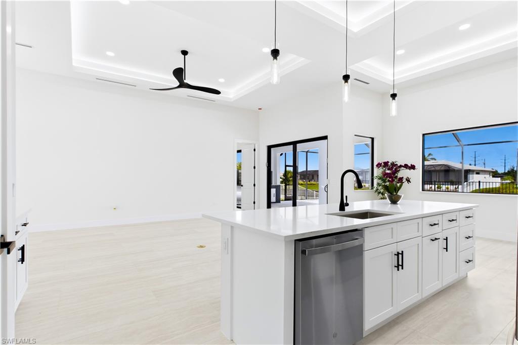 Oversized WATERFALL ISLAND w/ striking vertical WOOD SLAT DETAILING & abundant storage.