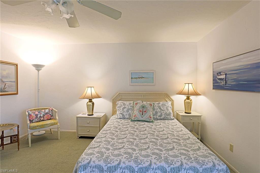 Recessed lighting, ceiling fan, and light-toned carpeting