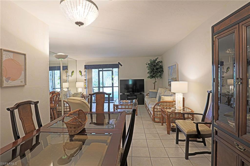 Recessed lighting, tile flooring, and wall-mounted air conditioning unit
