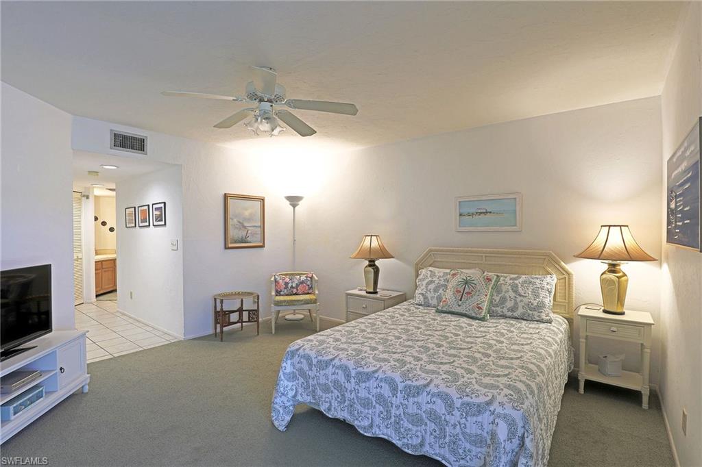 Recessed lighting, ceiling fan, carpet flooring, tile flooring, built-in cabinetry
