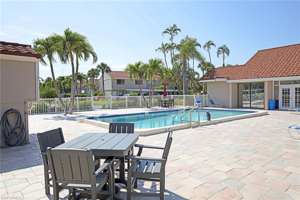 Outdoor swimming pool with integrated steps, surrounded by a paver patio