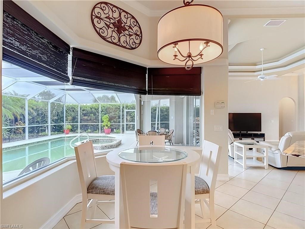 Screened lanai with a swimming pool and built-in spa