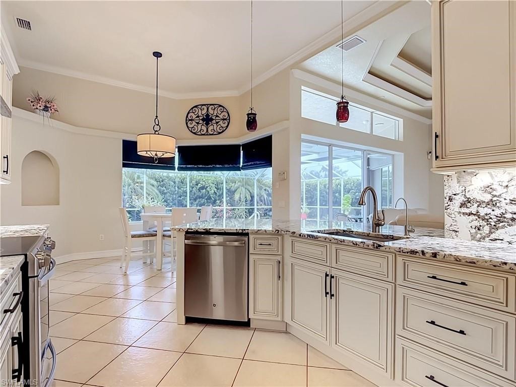 Kitchen featuring granite countertops, tile flooring, stainless steel appliances, white cabinetry, and a coffered ceiling