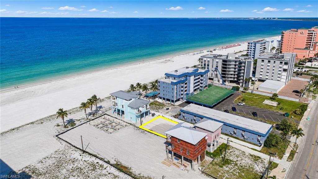 Coastal property featuring direct beach access and a level building site - Virtually Edited Image