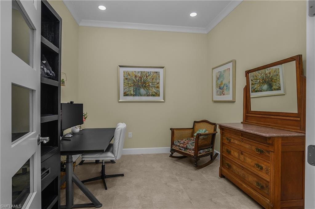 Recessed ceiling lighting, crown molding, and tiled flooring