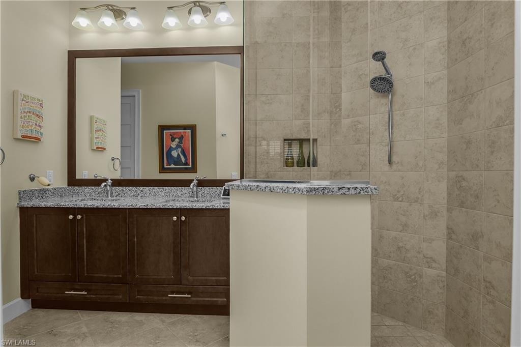 Dual sink vanity with dark wood-finish cabinetry