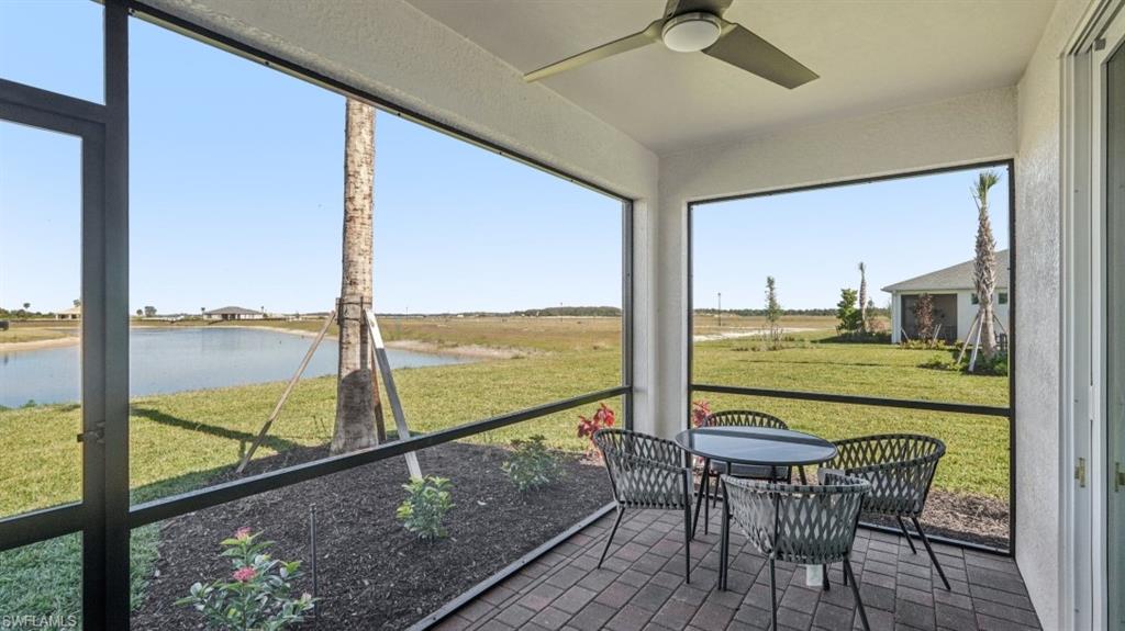 Screened patio featuring a paved surface, recessed lighting, and a ceiling fan