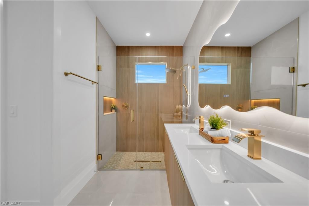 Dual vanity with integrated sinks and gold-finish faucets