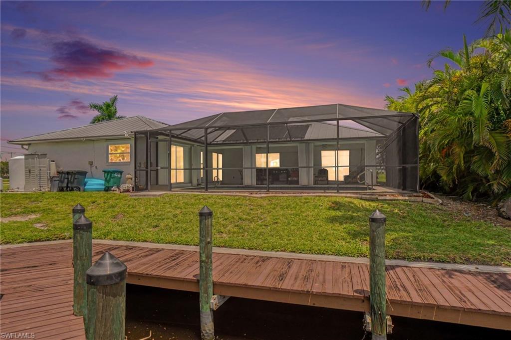 Screened-in outdoor living space with a concrete patio