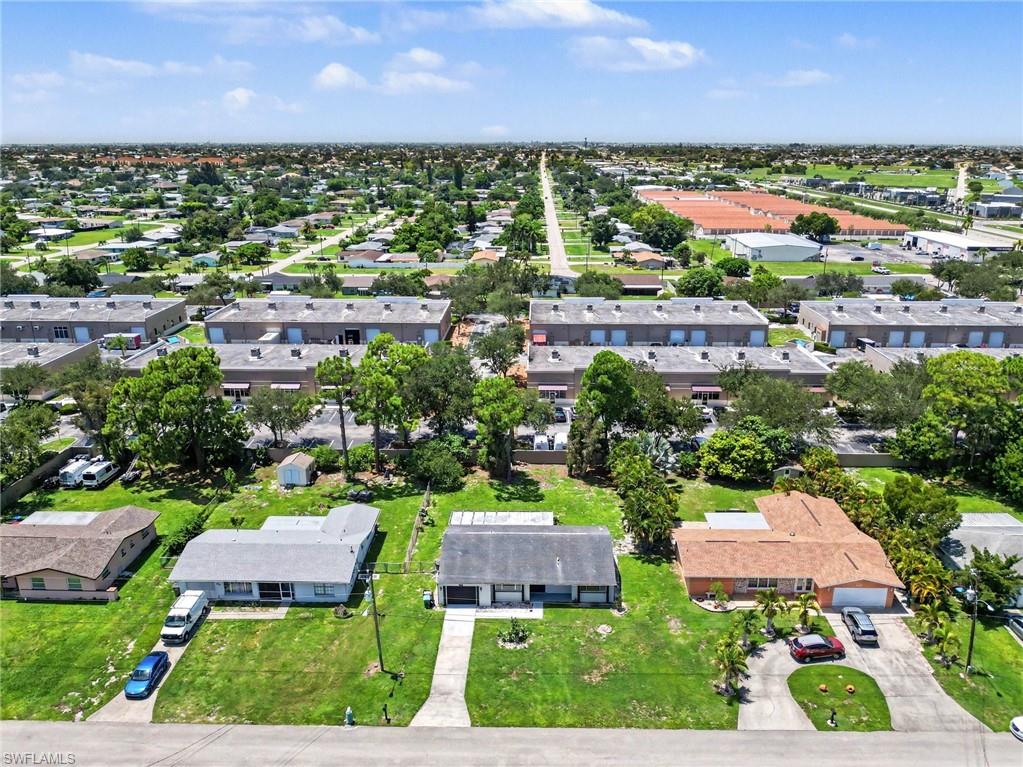 Aerial perspective showcasing the residential neighborhood with multiple detached homes